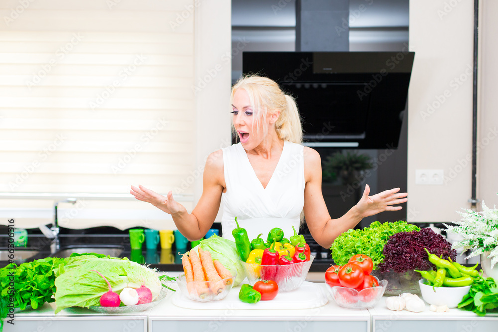 Happy woman cooks in the kitchen Happy woman cooks in the kitchen