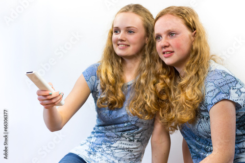 Valokuva Two girls watching TV