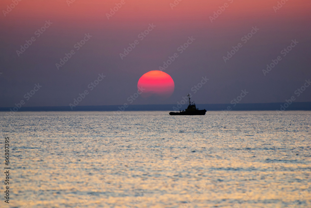 Bright sunrise under the sea with yellow red gradient colors and