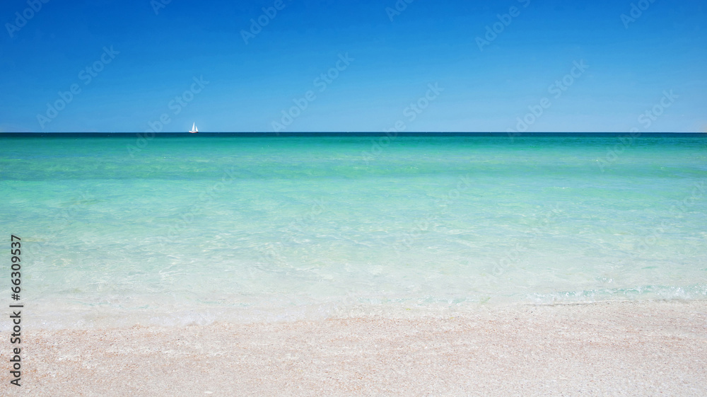 Beautiful sea background. Golden sea beach with blue transparent