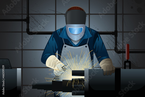 Welder working on a machine
