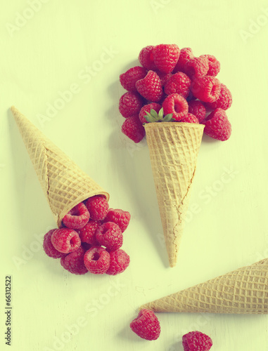 Strawberry in sugar cone. Toned image.