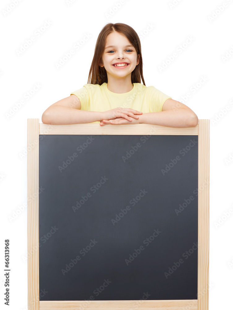 happy little girl with blank blackboard happy little girl with blank blackboard