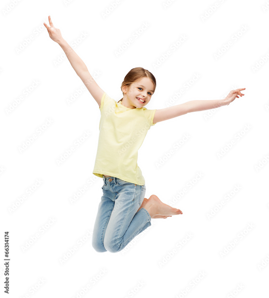 smiling little girl jumping Stock Photo | Adobe Stock