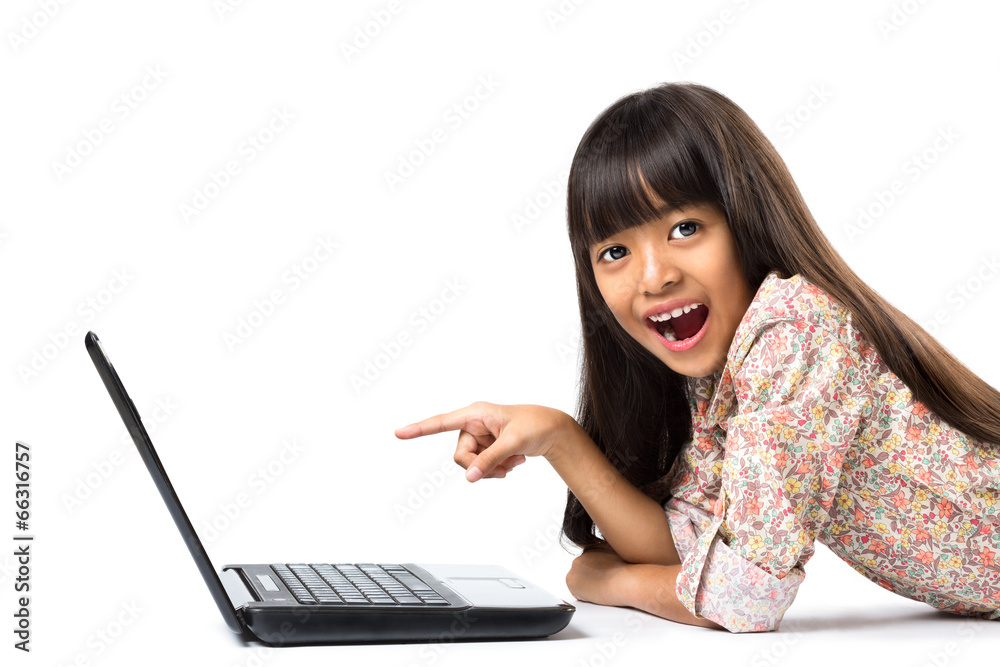 Smiling little asian girl with laptop computer Smiling little asian girl with laptop computer