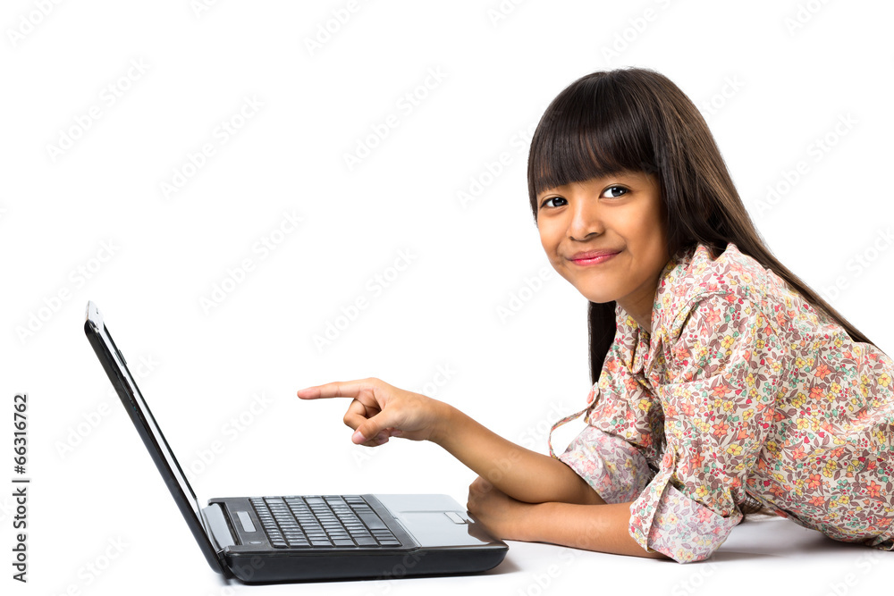 Smiling little asian girl with laptop computer Smiling little asian girl with laptop computer