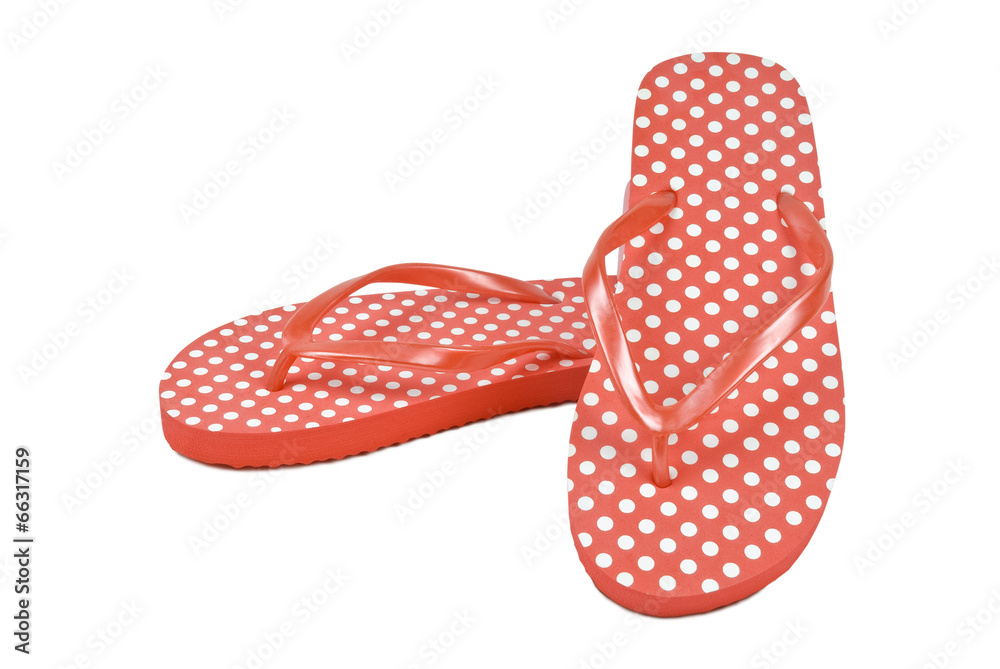 Spotted flip flops or thongs on white. Clipping path included. Spotted flip flops or thongs on white. Clipping path included.
