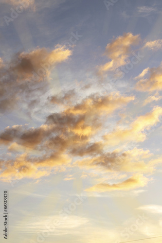 Bright sunlit clouds sky background