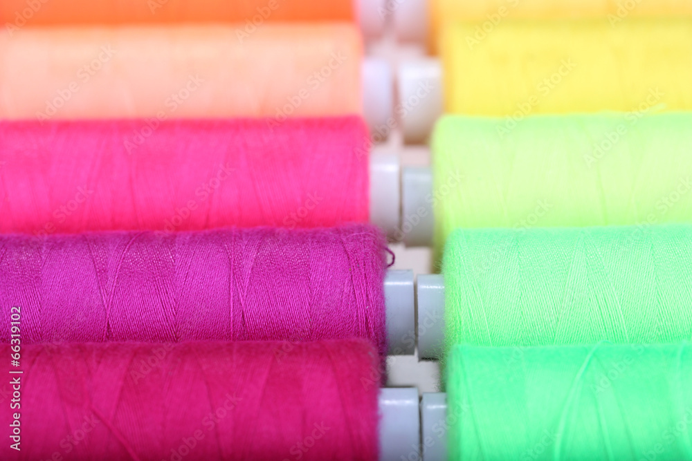 Multicolor sewing threads background Multicolor sewing threads background