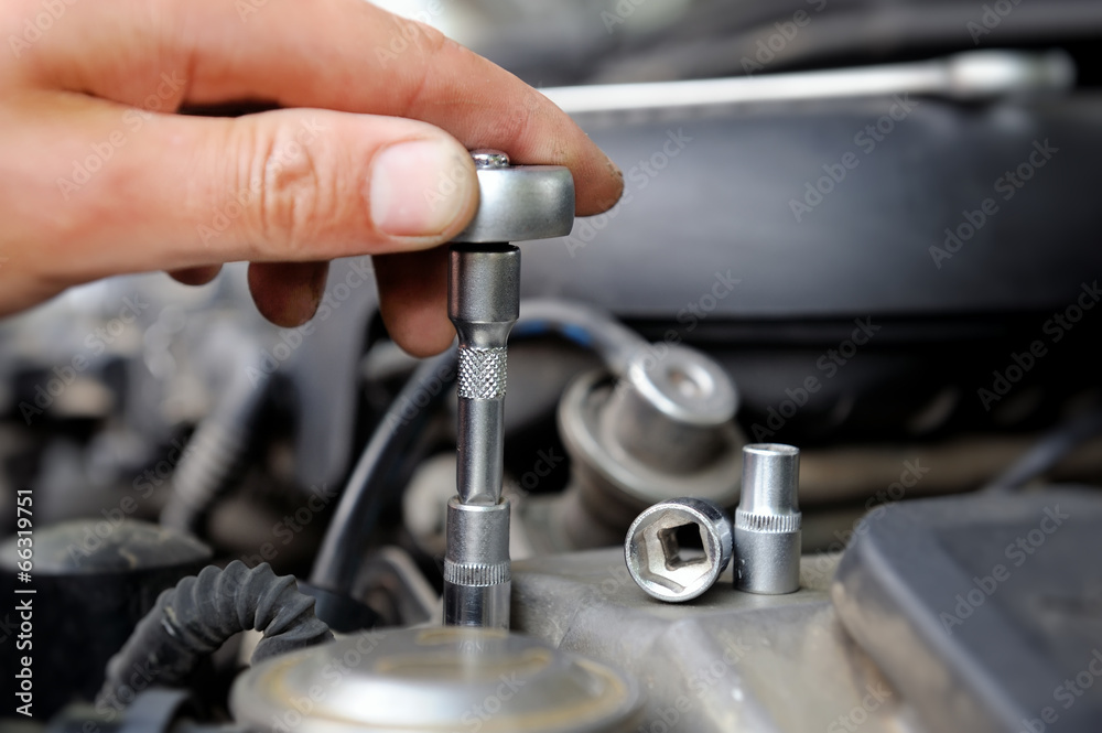 Hands of car mechanic Hands of car mechanic