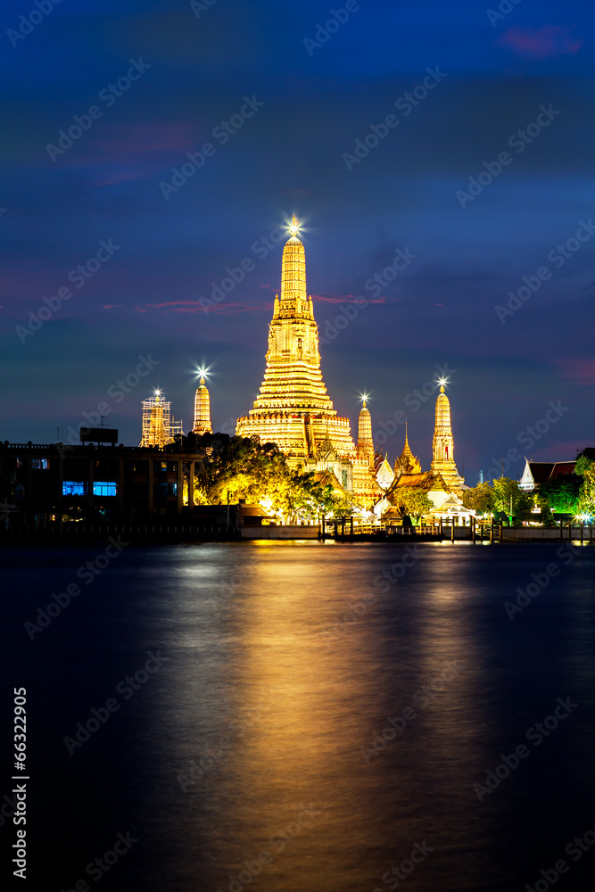 The beautiful temple along the Chao Phraya river at dusk