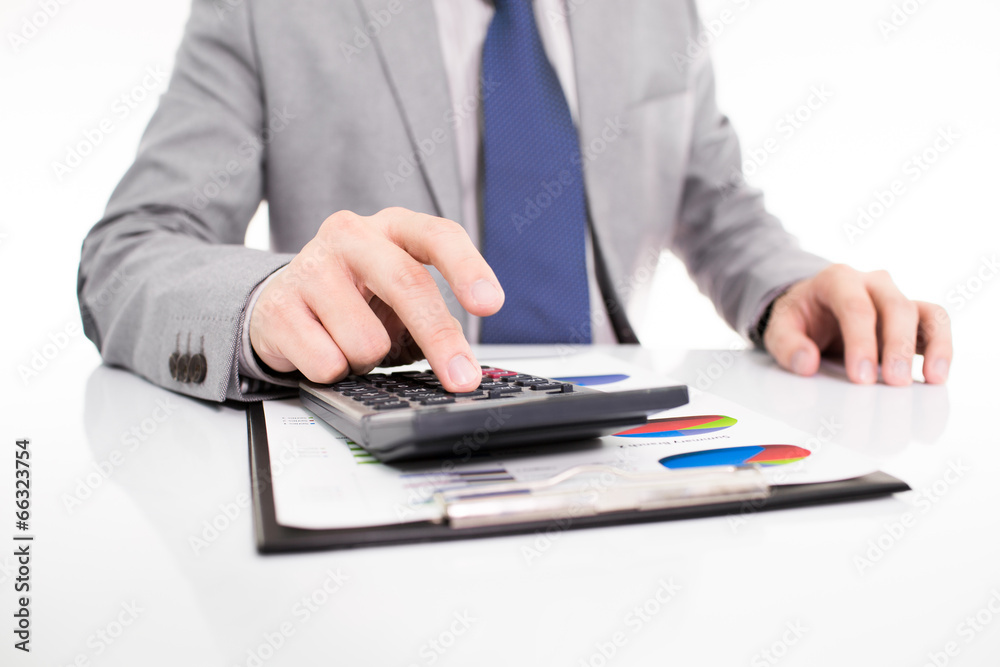 Businessman analyzing investment charts with laptop Businessman analyzing investment charts with laptop