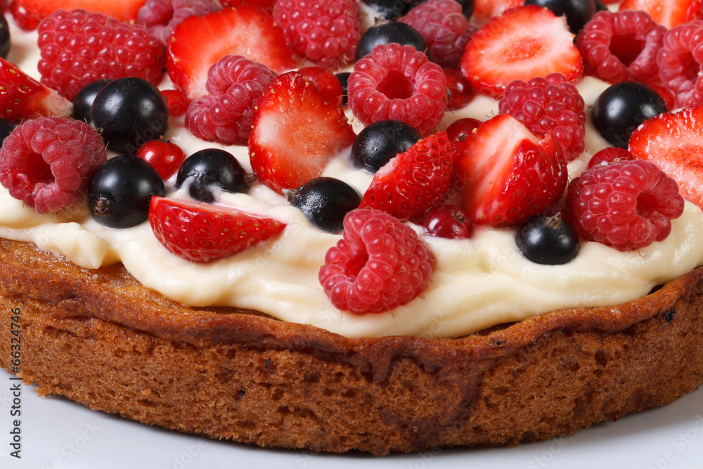 Colorful pie with fresh berries and cream close up