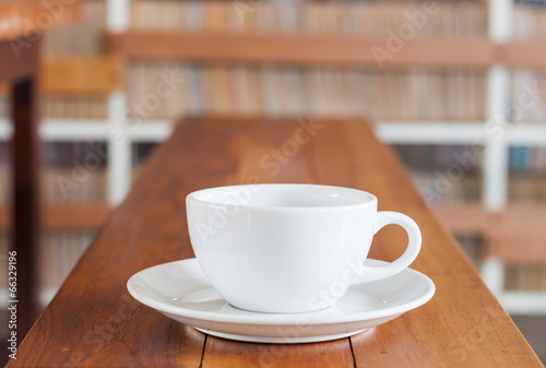 White coffee cup on wooden table