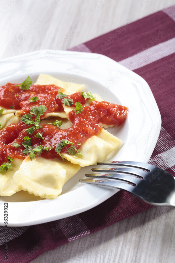 Portion of ravioli with tomato sauce Portion of ravioli with tomato sauce