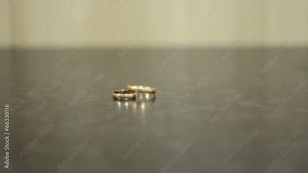 two beautiful wedding rings lie on a dark background two beautiful wedding rings lie on a dark background