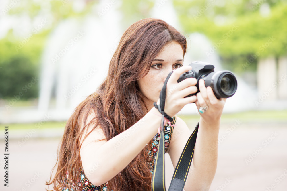 Photographer focused on her work.