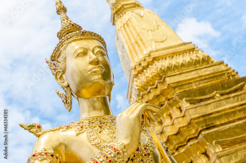 Golden Angel with Pagoda Wat Pra Kaeo, Thailand photo