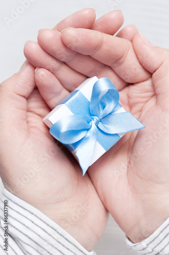 Small gift in female hands