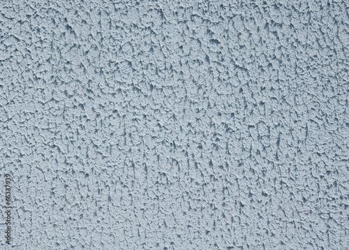 Blue rough plaster on wall closeup