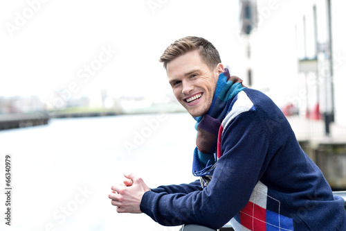 Stylish young man beside river railing Free Download Stylish young man beside river railing - GFXLoad