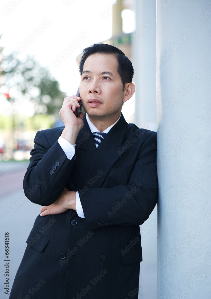 Businessman on mobile phone outdoors Businessman on mobile phone outdoors