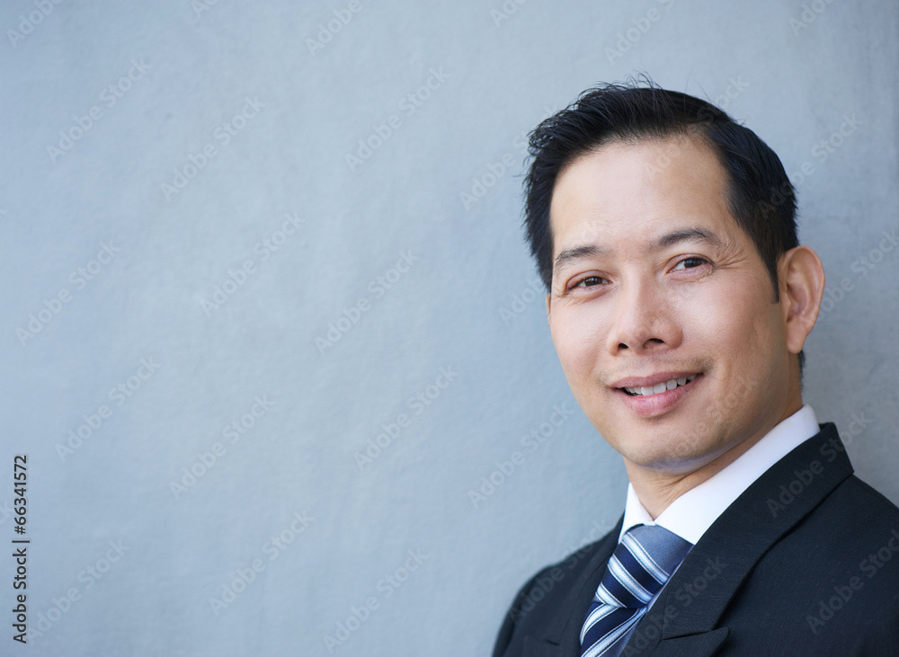 Friendly businessman smiling Friendly businessman smiling
