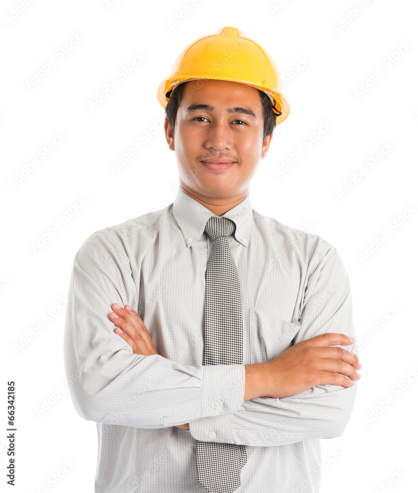 Asian male wearing yellow hardhat. Asian male wearing yellow hardhat.