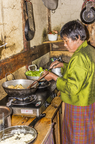 bhutanese woman in  the kitchen photo