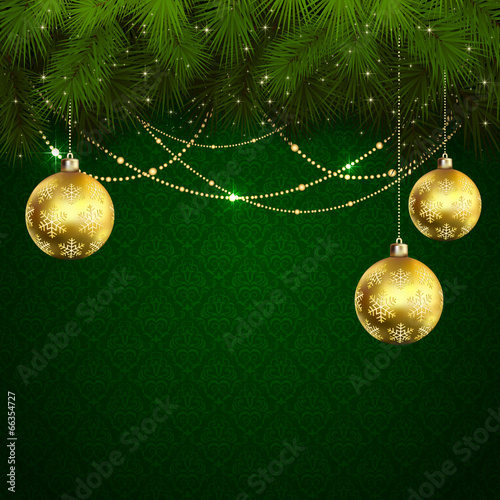 Christmas balls on green wallpaper