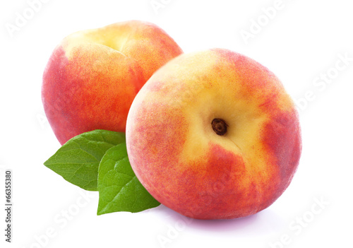 Ripe peach with leaf