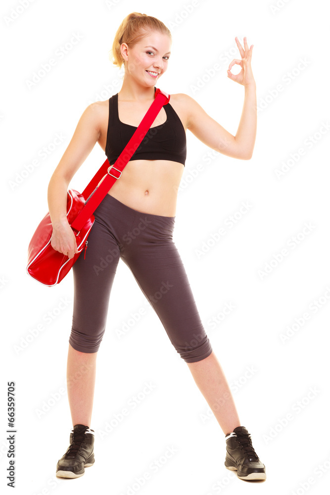 Sport. Fitness girl with gym bag showing ok hand sign Sport. Fitness girl with gym bag showing ok hand sign