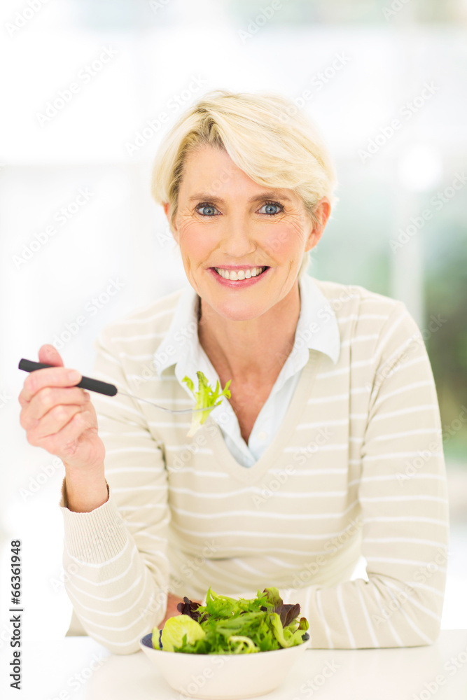 healthy senior woman having vegetable salad healthy senior woman having vegetable salad