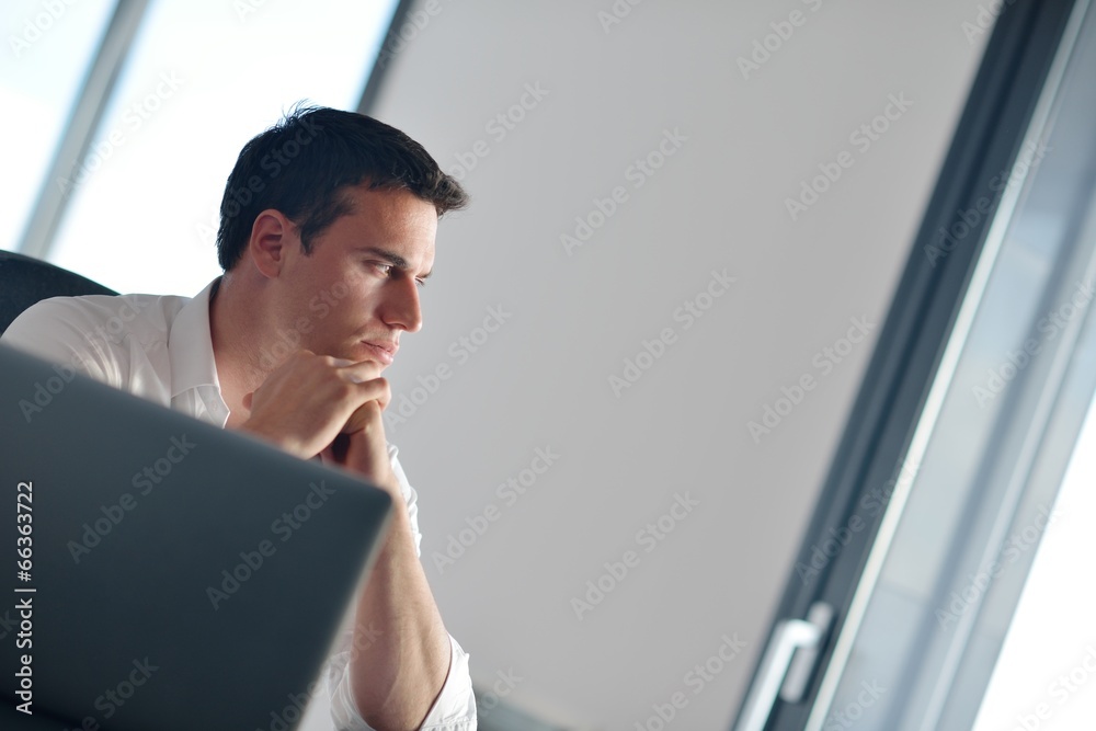 business man working on laptop computer at home business man working on laptop computer at home