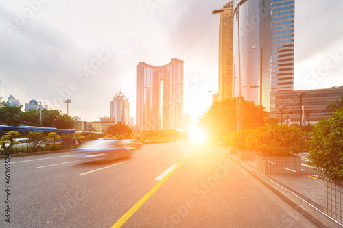 road in city with sunset