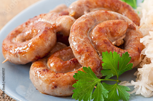 Bavarian fried sausages on sauerkraut