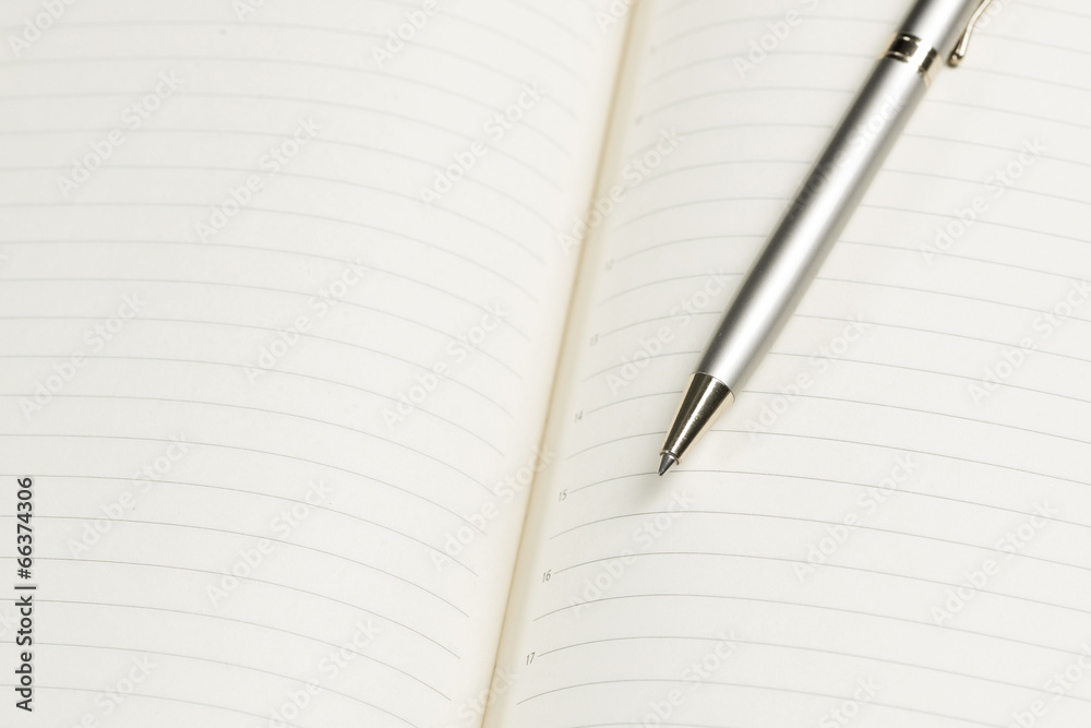 pen and open notepad pen and open notepad
