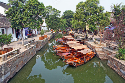 Landscape of Tongli watertown with traditional boats and old hou