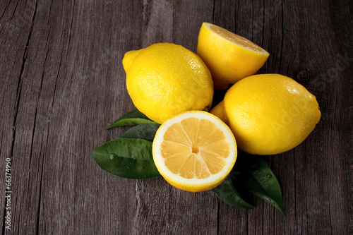 Lemons on wooden background