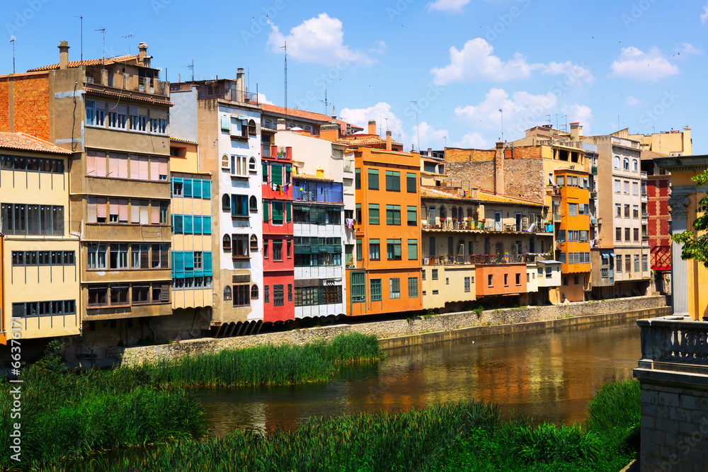 Day view of river and picturesque houses in Girona