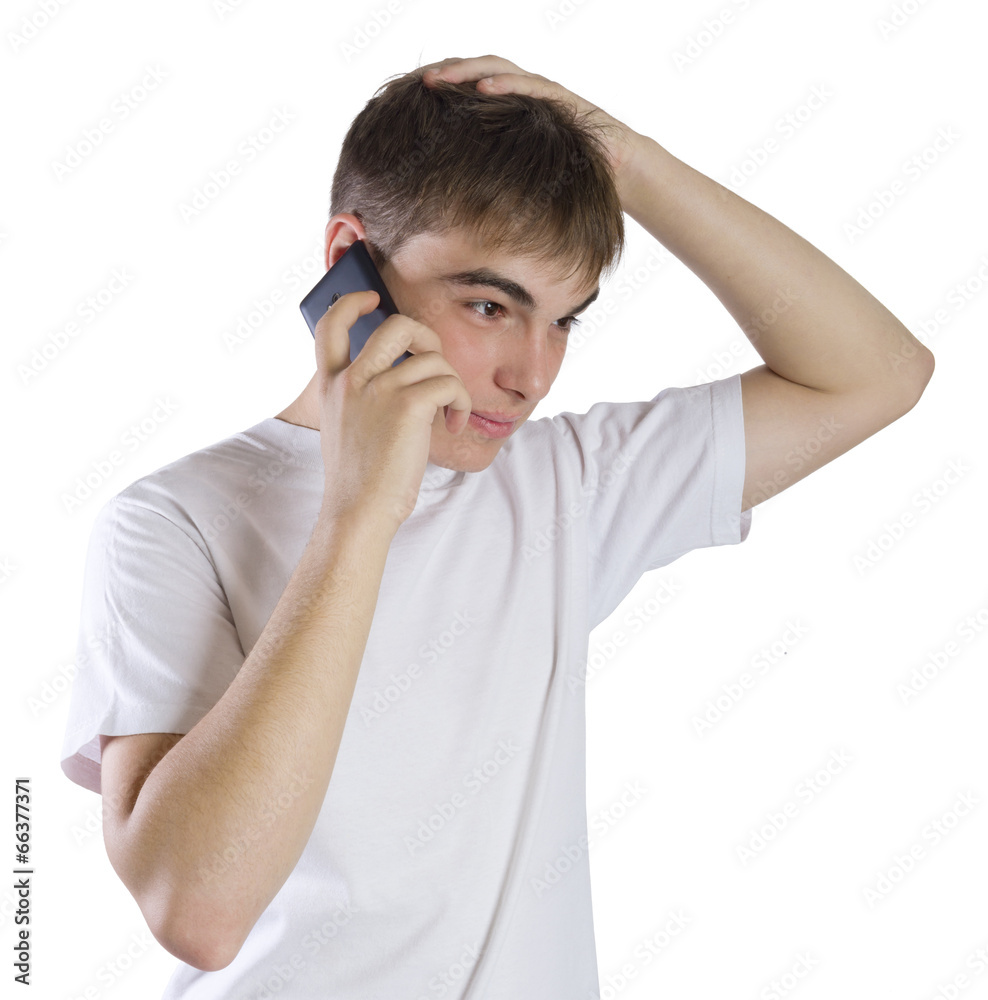 Young man portrait talking on a phone isolated on white Young man portrait talking on a phone isolated on white