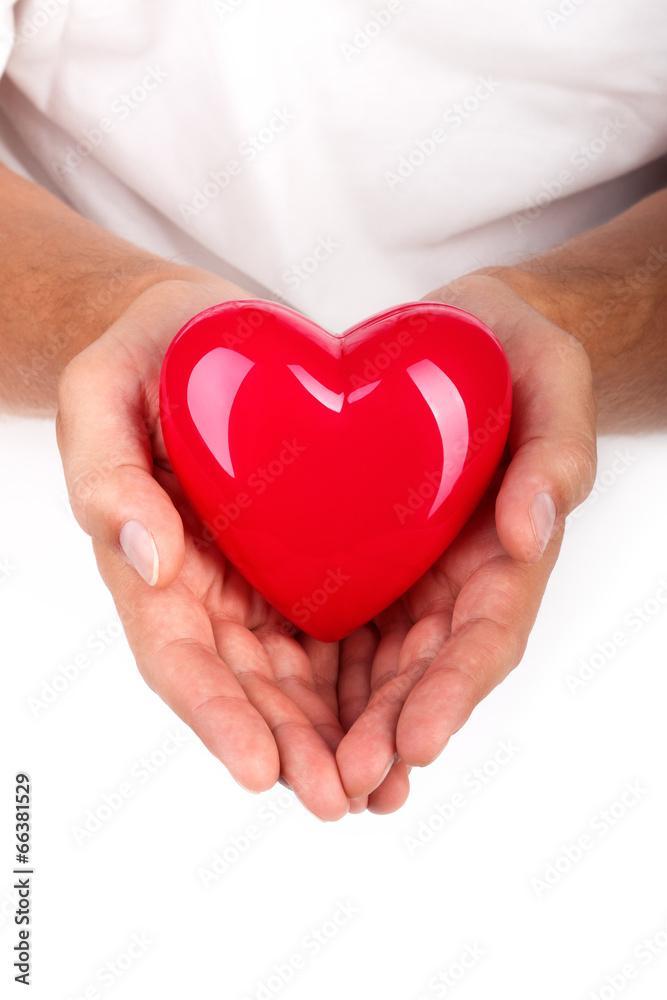Male hands holding red heart