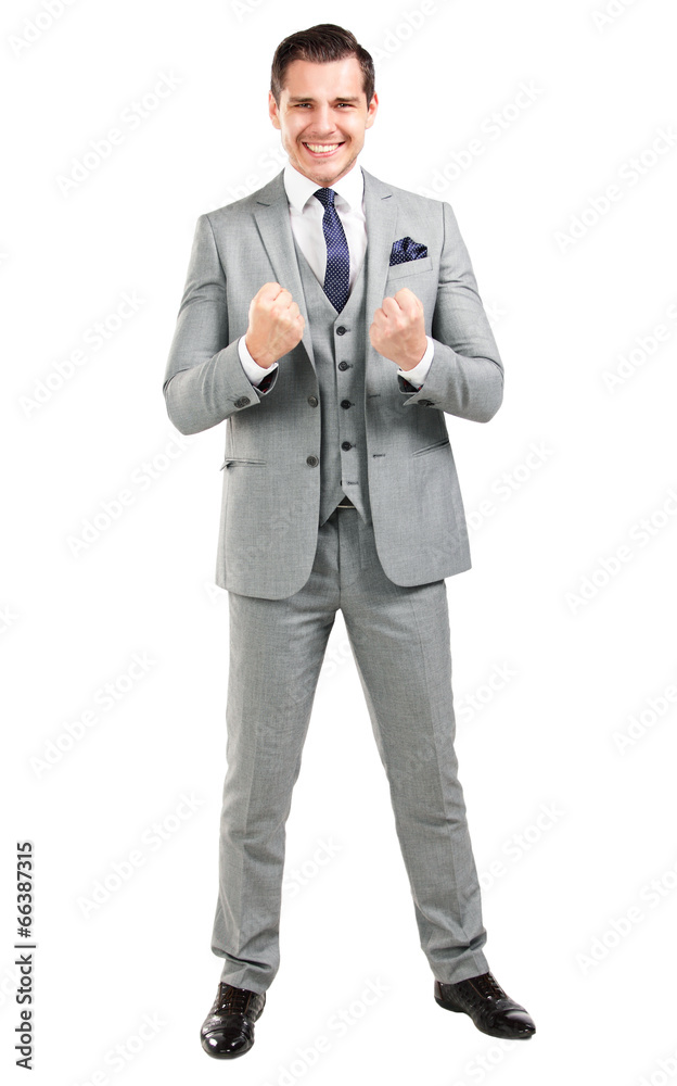 Excited handsome business man with arms raised in success Excited handsome business man with arms raised in success