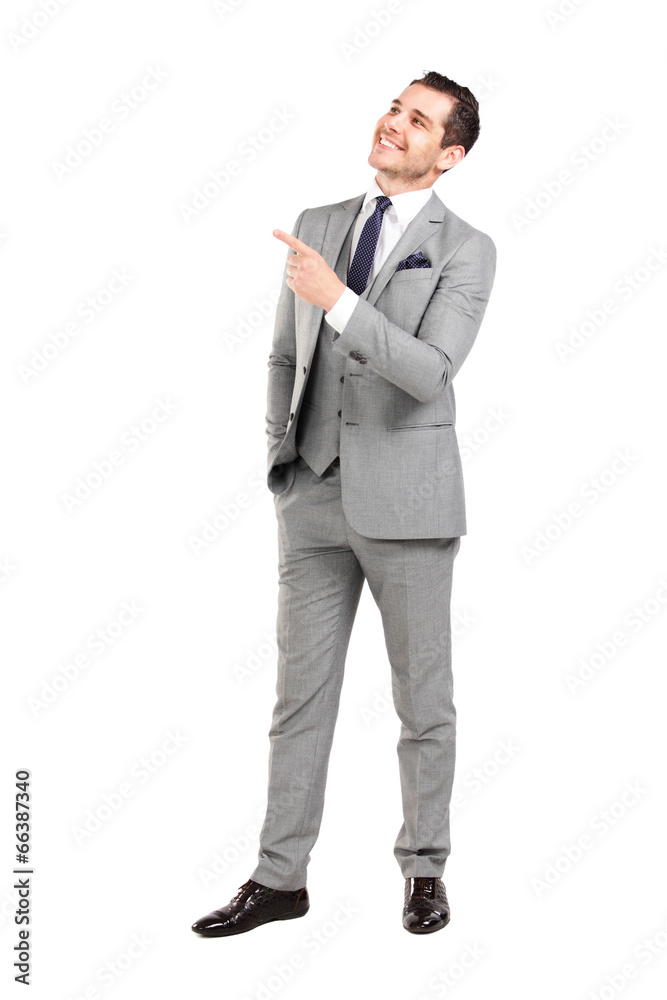 Young surprised business man pointing at something interesting Young surprised business man pointing at something interesting