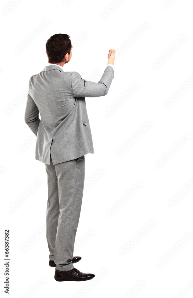 business man from the back - looking at something over a white business man from the back - looking at something over a white