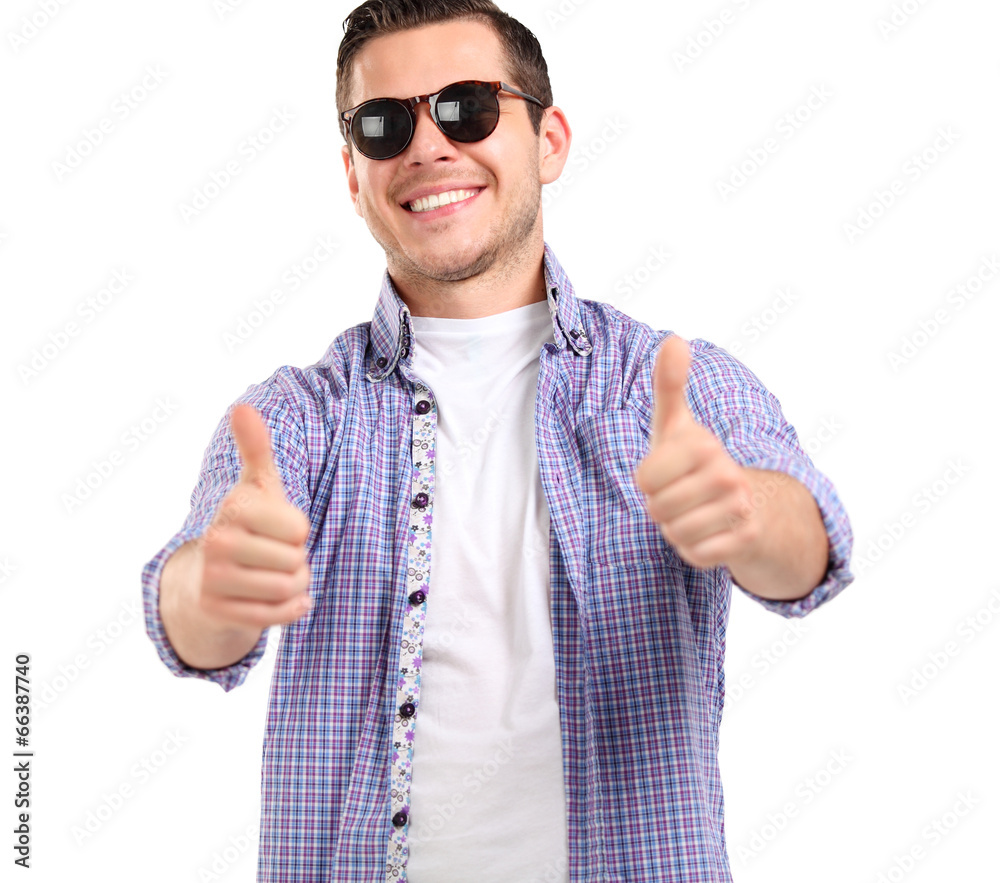 young casual man showing the thumb up gesture young casual man showing the thumb up gesture