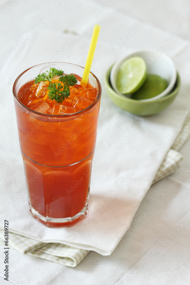 a glass of tea decorated with fresh lime