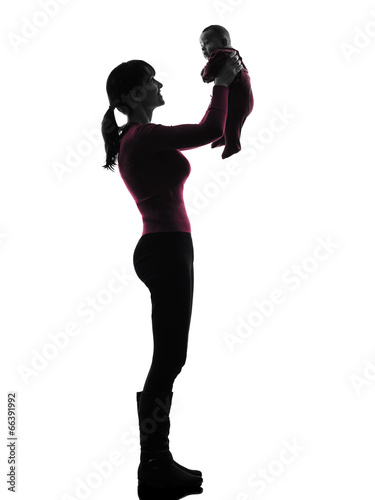 woman mother holding baby silhouette