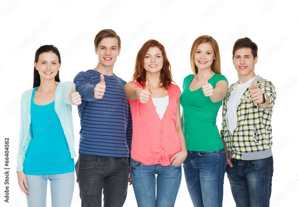 group of smiling students showing thumbs up group of smiling students showing thumbs up