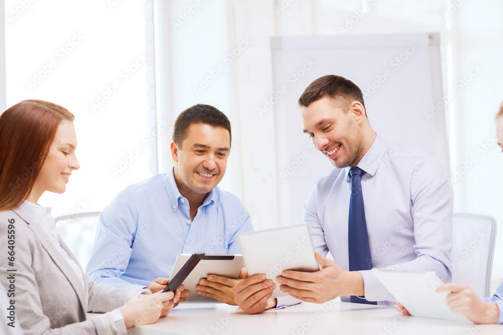business team working with tablet pc in office business team working with tablet pc in office